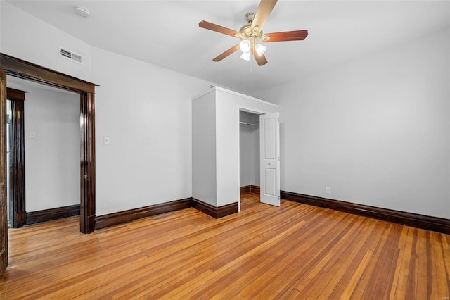 unfurnished bedroom featuring a closet, ceiling fan, and light hardwood / wood-style flooring