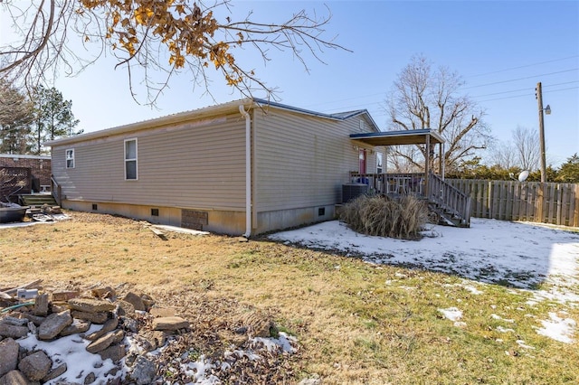 view of side of home featuring central air condition unit