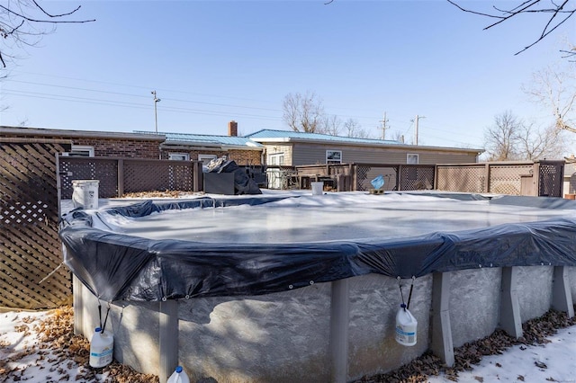 view of snow covered pool