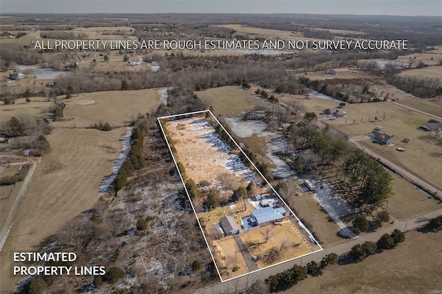 birds eye view of property featuring a rural view