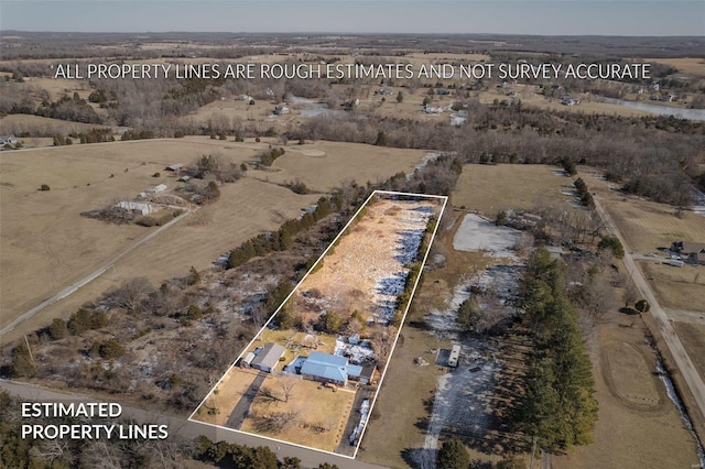 birds eye view of property featuring a rural view