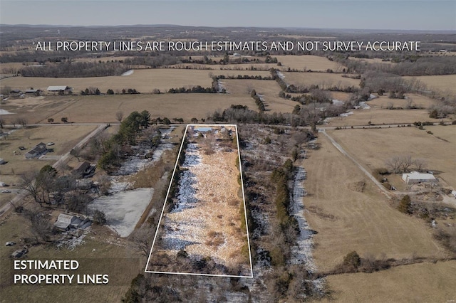 birds eye view of property featuring a rural view