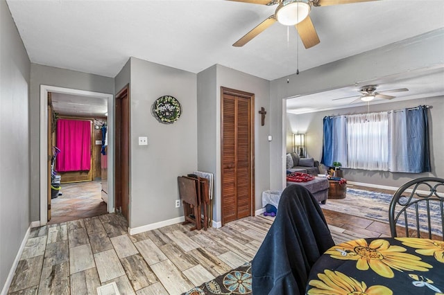 bedroom featuring ceiling fan and a closet