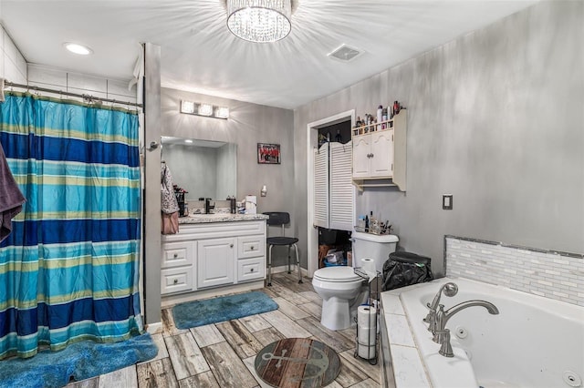full bathroom with independent shower and bath, vanity, an inviting chandelier, and toilet