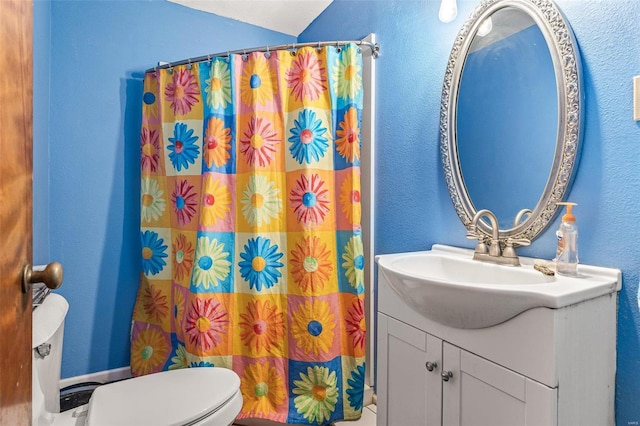 bathroom with vanity, toilet, and a shower with shower curtain