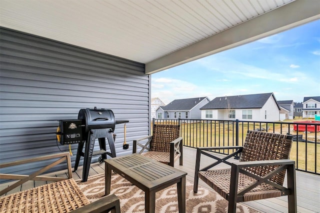 wooden terrace with a grill