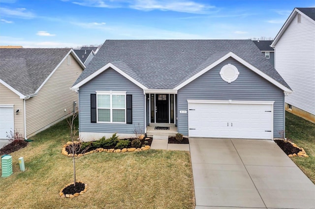 view of front facade featuring a garage and a front lawn