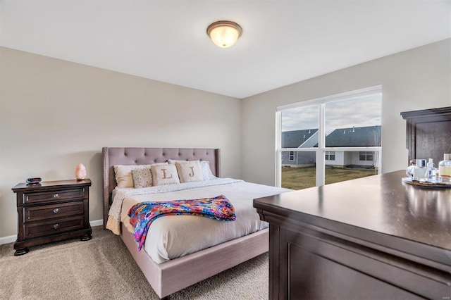 bedroom with light colored carpet