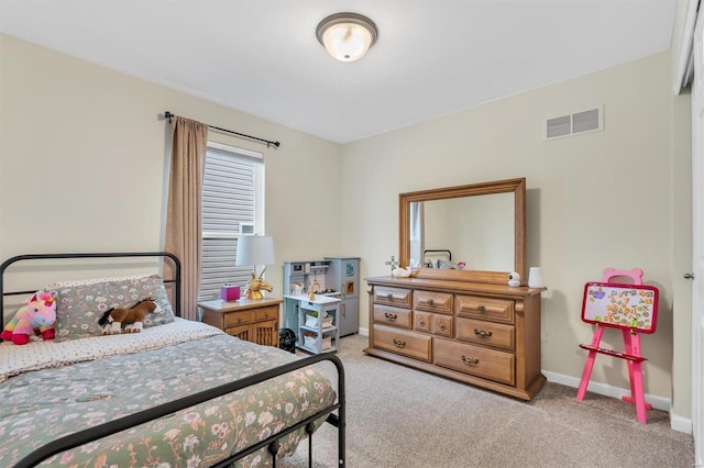 bedroom with light carpet