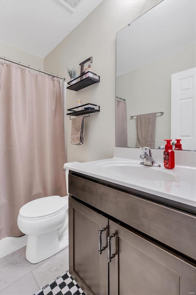 bathroom with vanity and toilet