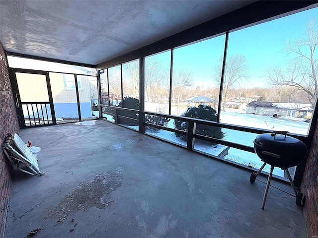 unfurnished sunroom with a healthy amount of sunlight