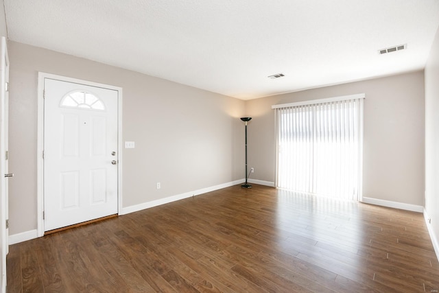 foyer entrance with dark hardwood / wood-style flooring