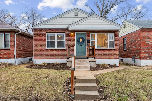 bungalow with a front yard