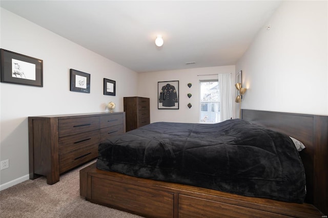 bedroom featuring light carpet