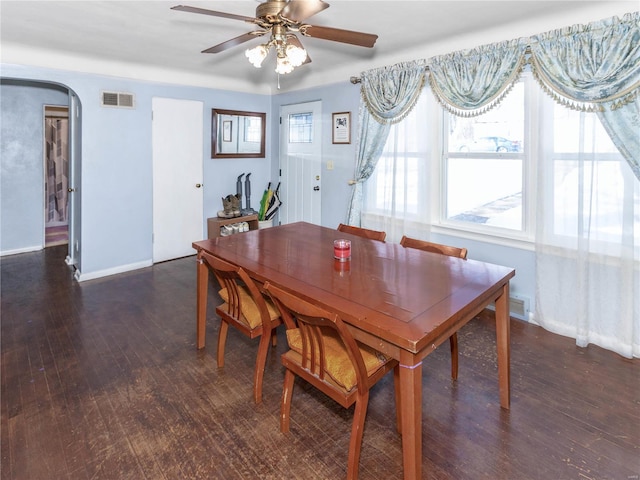 dining area featuring dark wood-type flooring and ceiling fan