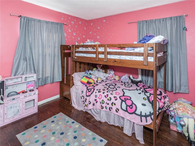 bedroom with dark wood-type flooring