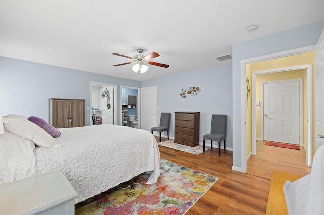 bedroom with wood-type flooring and ceiling fan