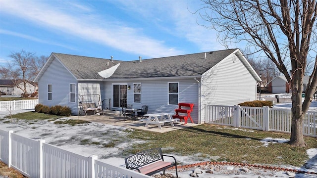 snow covered property with a patio area