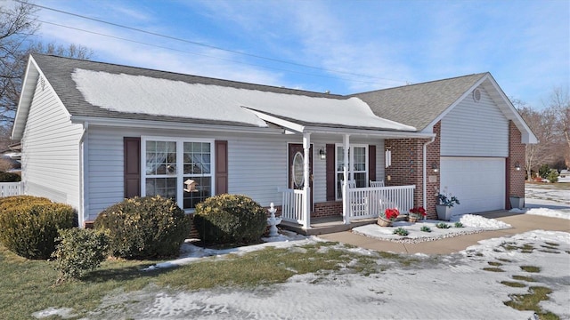 view of front facade featuring a garage and a porch