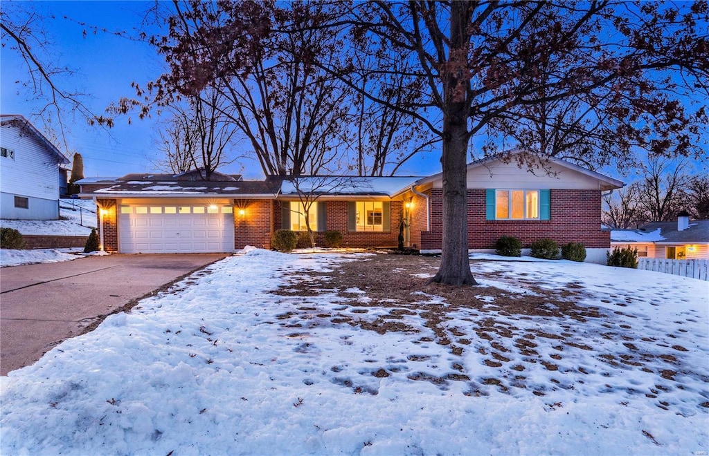 single story home featuring a garage