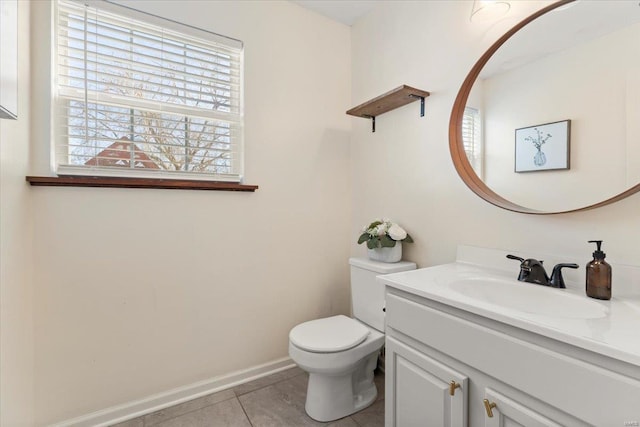 bathroom featuring vanity, tile patterned floors, and toilet