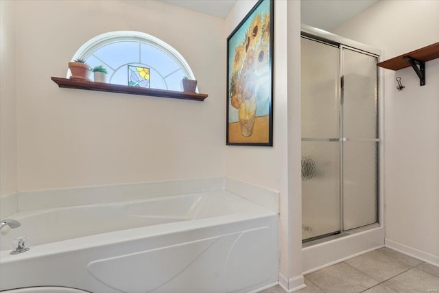 bathroom featuring tile patterned flooring and independent shower and bath