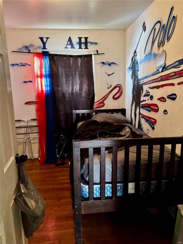 bedroom featuring dark wood-type flooring