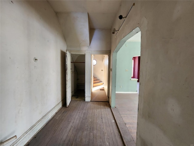 corridor featuring wood-type flooring