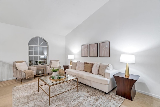 living room with high vaulted ceiling