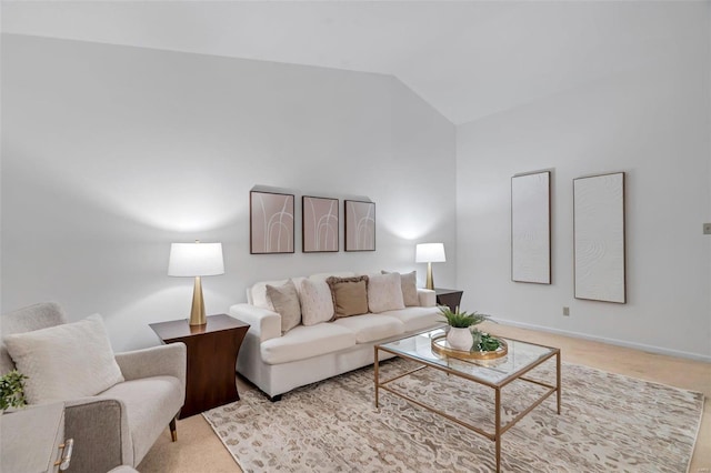 living room with light carpet and vaulted ceiling