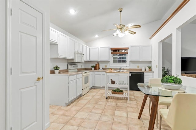 kitchen featuring white appliances, light tile patterned floors, white cabinets, sink, and lofted ceiling