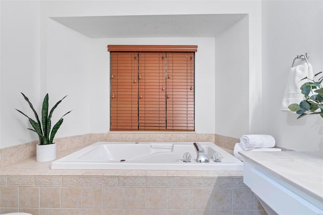 bathroom featuring tiled tub