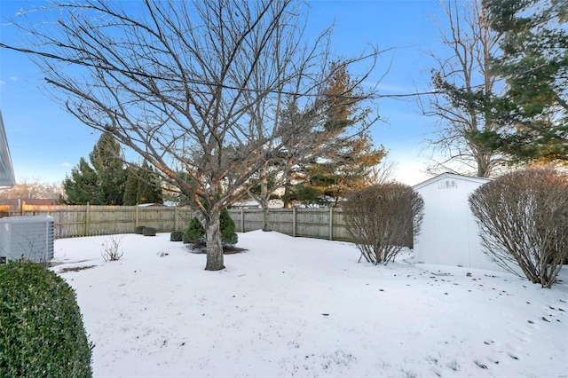 yard covered in snow with central AC