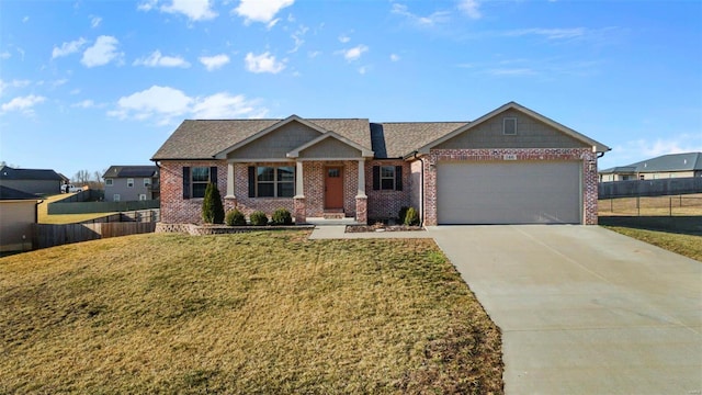 view of front of house featuring a garage and a front lawn