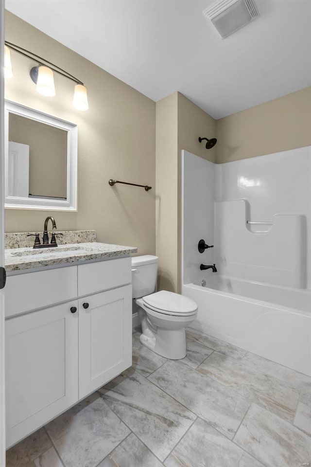 full bathroom with vanity, toilet, and shower / bath combination