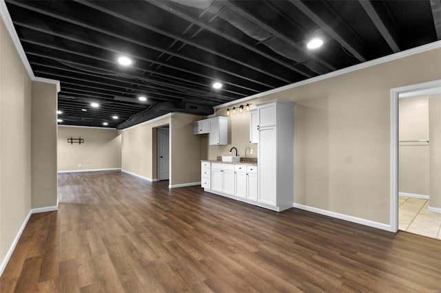 unfurnished living room with dark wood-type flooring