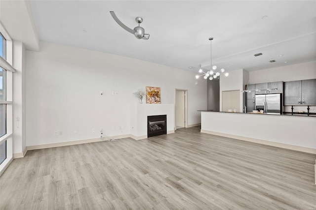 unfurnished living room featuring light wood-type flooring