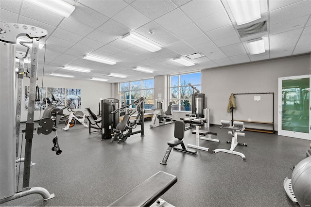 gym featuring a paneled ceiling