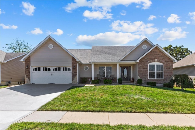 view of front facade featuring a garage, concrete driveway, brick siding, and a front yard