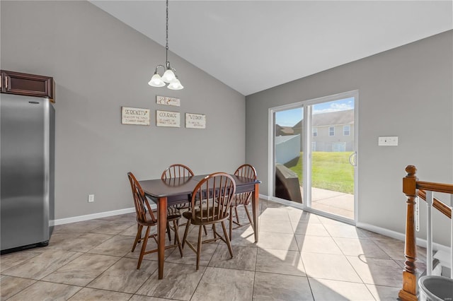 dining space featuring vaulted ceiling, light tile patterned flooring, a chandelier, and baseboards