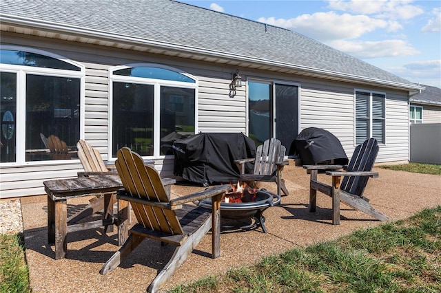 view of patio / terrace with a fire pit