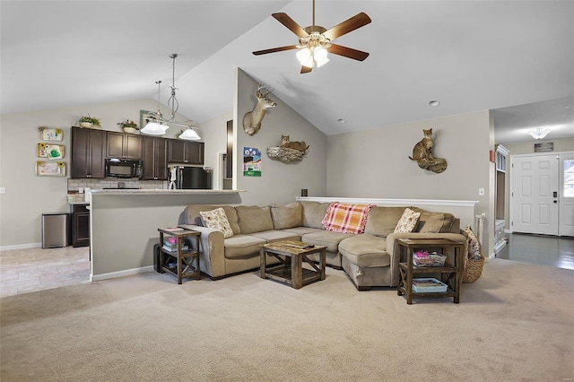 carpeted living room featuring high vaulted ceiling and ceiling fan