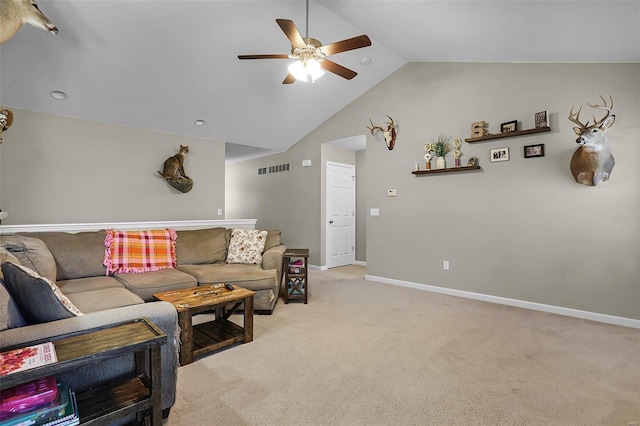 carpeted living room with vaulted ceiling and ceiling fan