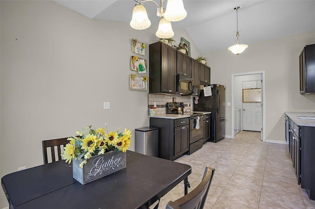 kitchen with dark brown cabinetry, lofted ceiling, black appliances, hanging light fixtures, and backsplash