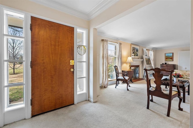 entryway featuring crown molding and light colored carpet