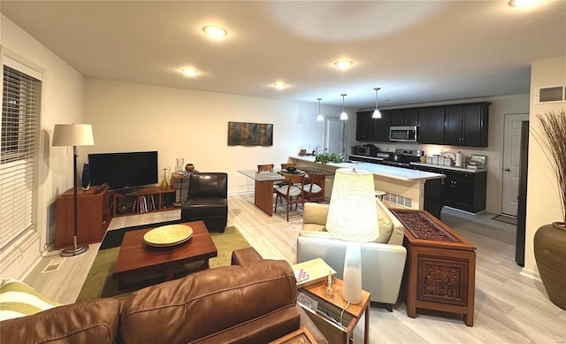 living room featuring light wood-type flooring