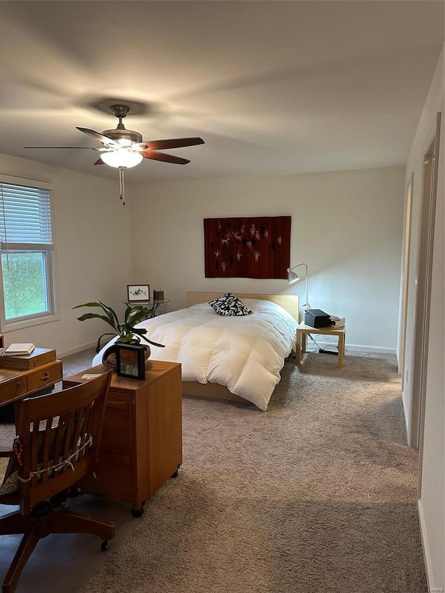 bedroom with ceiling fan and carpet flooring