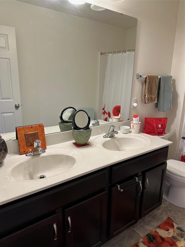 bathroom with vanity, toilet, and a shower with shower curtain