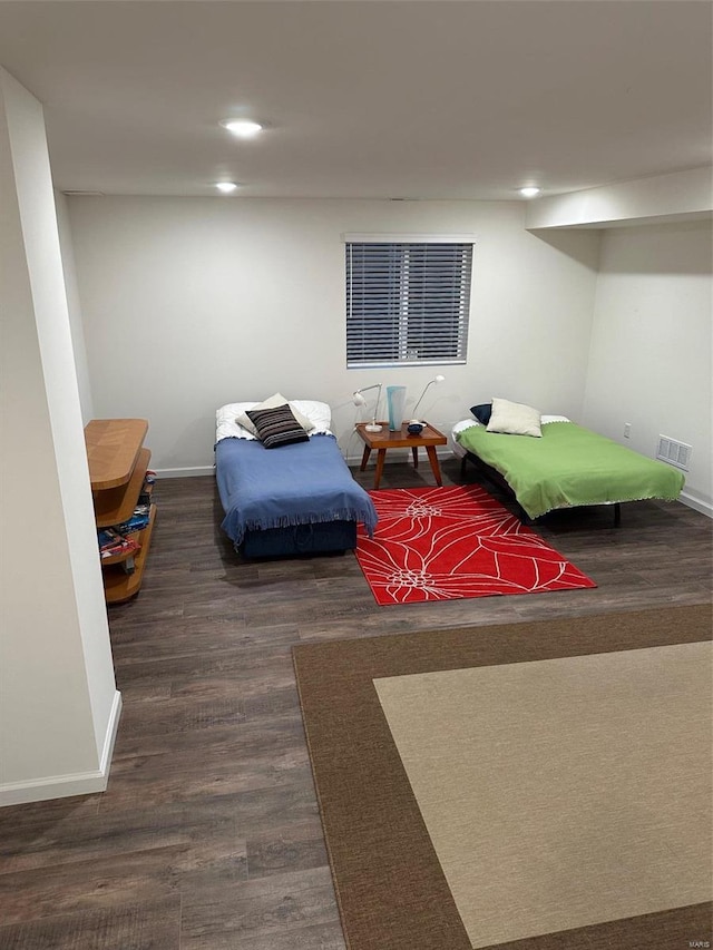 bedroom featuring dark hardwood / wood-style flooring