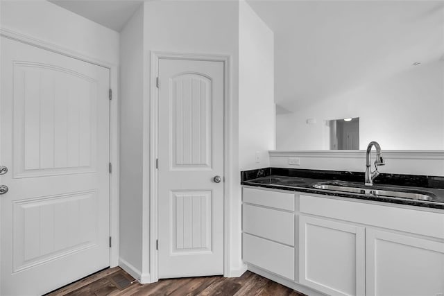 bathroom featuring wood-type flooring and vanity